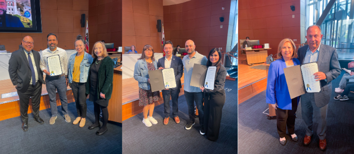Councilmembers presenting proclamations to recipients in Council Chambers