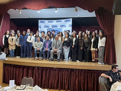 City Council members with several scholarship recipients on stage at the SSF Chamber Scholarship Luncheon