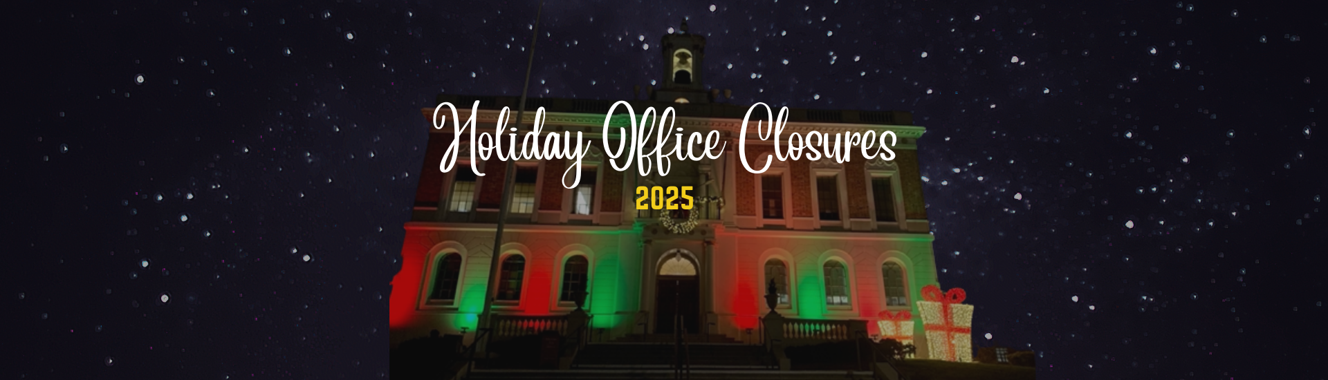 City Hall with holiday decorations under a starry night sky