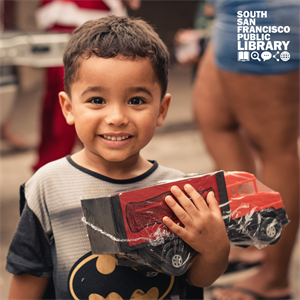 boy holding toy truck