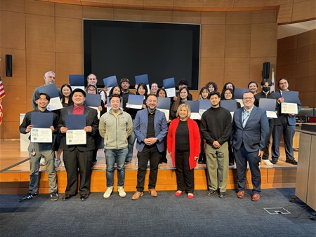 Youth in Government participants with their teachers and City Council in front of the dais