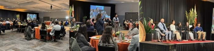 Mayor Eddie at the State of the City in the South San Francisco Conference Room. He is wearing a dark blue suit, is standing in the middle of the room, and surrounded by attendees having lunch on table rounds