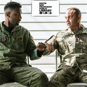 Two male veterans sitting down and conversing with one another