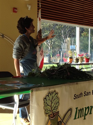 Sharon Ranals leading a wreath-making workshop
