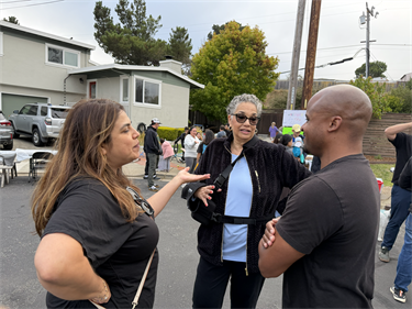 Community-members-talking-outside-NNO-2026.png