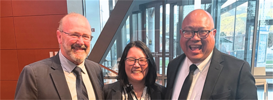 Mayor Addiego and Vice Mayor Nagales standing with the 2026 Woman of the Year, Amy Lam