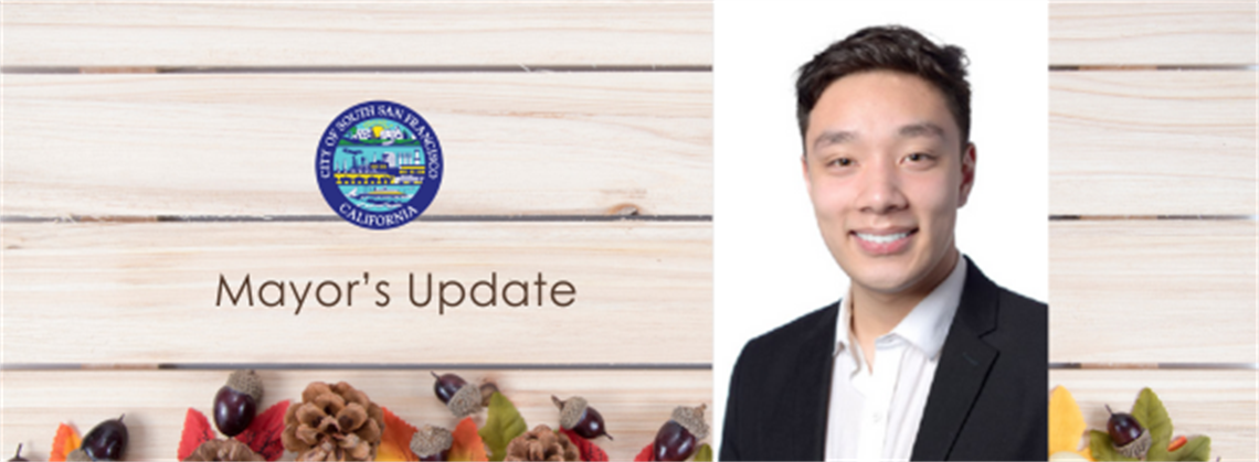 A Thanksgiving banner with a photo of Mayor Coleman, pumpkins, and squash