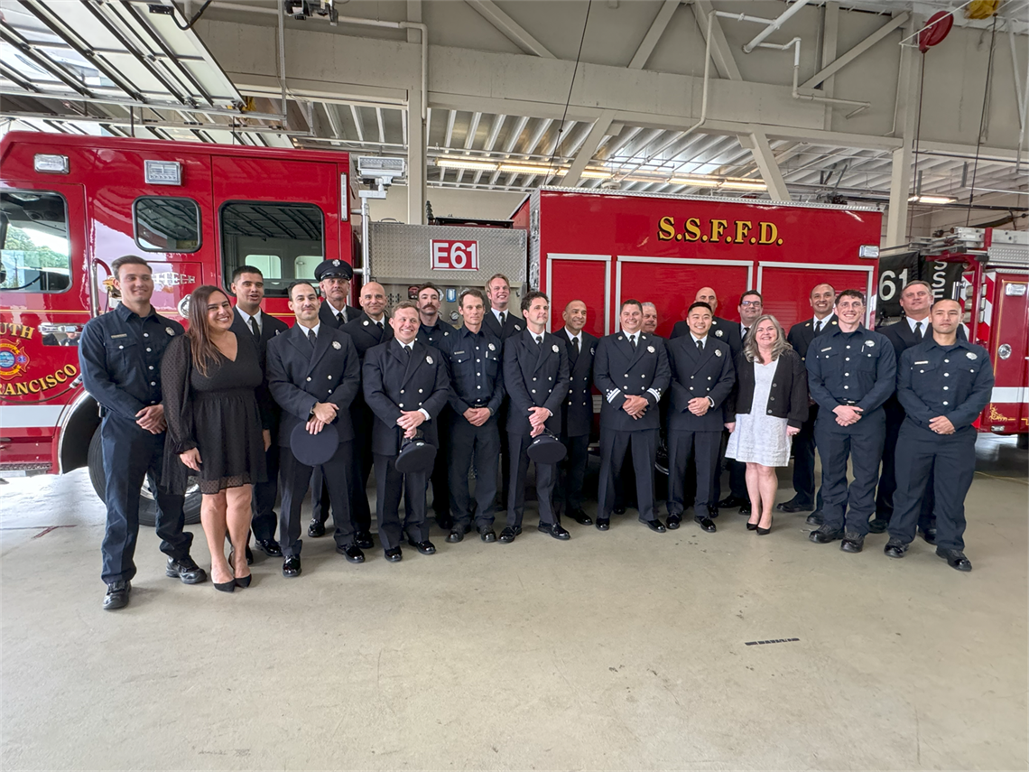 Photo of fire personnel recognized at Spring 2024 ceremony standing in front of fire engine at SSFFD Station 61