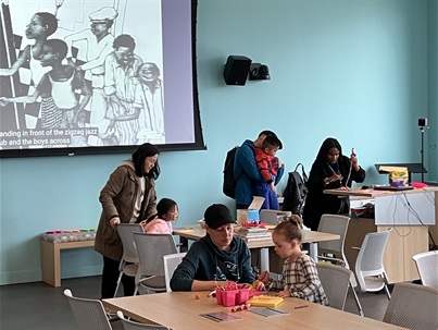 Library patrons and staff attending craft program