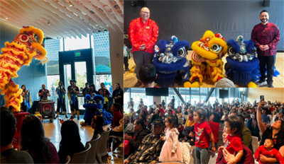 Lion dancers and children looking amused at the Lunar New Year Celebration