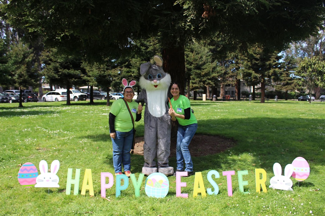 Recreation staff with the Easter Bunny at Orange Memorial Park during the Easter Bunny Photo Hop Event