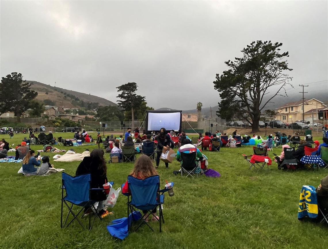 Community members at Movie Night in the Park Martin Elementary School