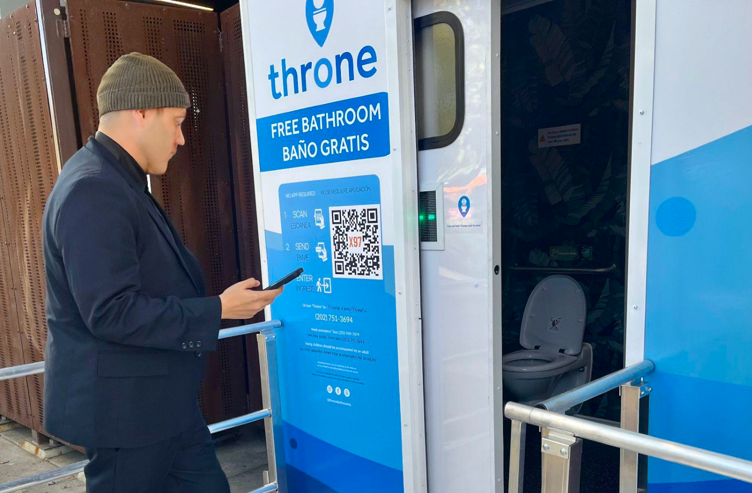 man entering throne with phone