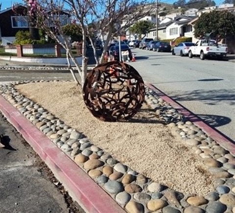 45 inch metal sphere on street median