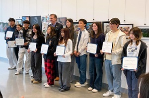 Student artists with certificates