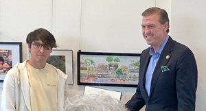 Young man receiving certificate from official