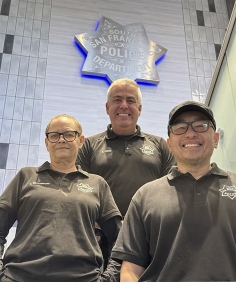 Property and Evidence team standing on a staircase with the SSFPD badge behind them