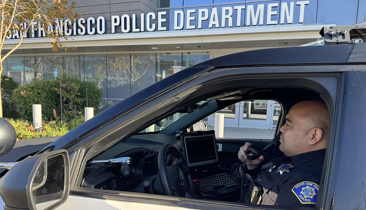 Officer In Patrol Car